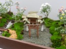 A tiny model of a shrine at an exhibition on the way to th Meiji Shrine